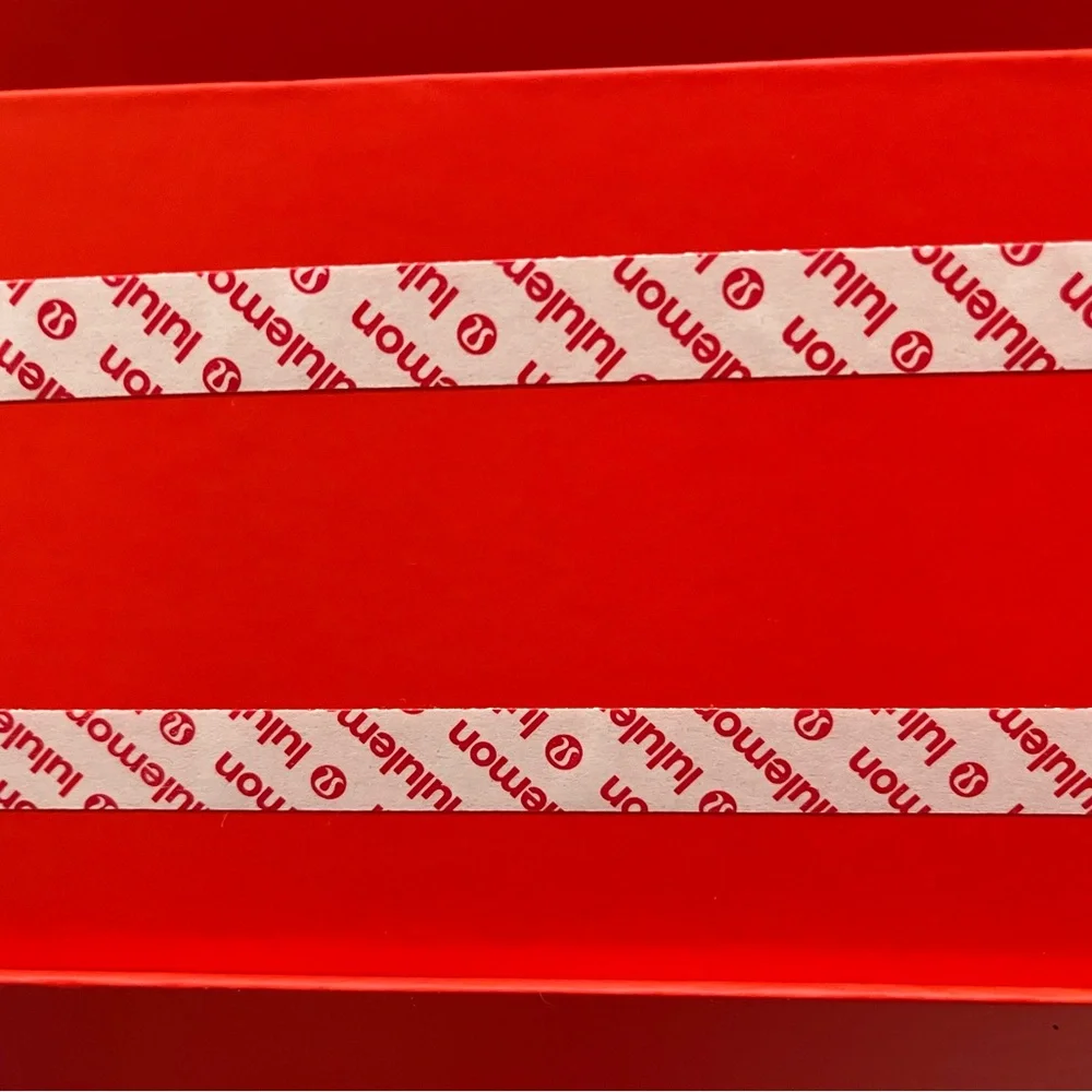 Lululemon — Vibrant Orange Decorative Gift Box.